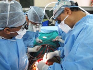 Dr. Devi Shetty operates on a young man, one of the 14,000 patients who underwent surgery at Narayana Health last year. Fifty-eight surgeons work six days a week performing surgery at the Bangalore center. Shetty's group has grown to 29 hospitals around India